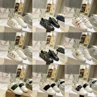 Rows of white low-top trainers with coloured heel tabs
