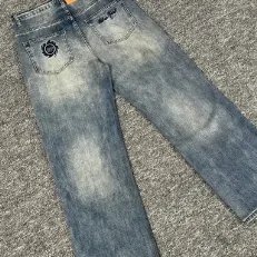Blue denim jeans with visible pockets and seams