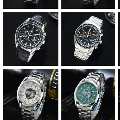 Steel bracelet watches with black, green and silver dials in a display case