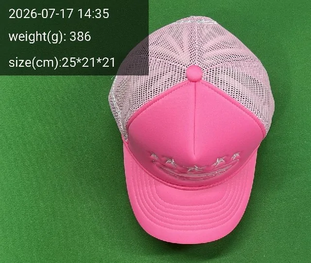 Oopbuy QC photo of a pink trucker cap on a green ruler mat with timestamp, weight 386 g and size overlay