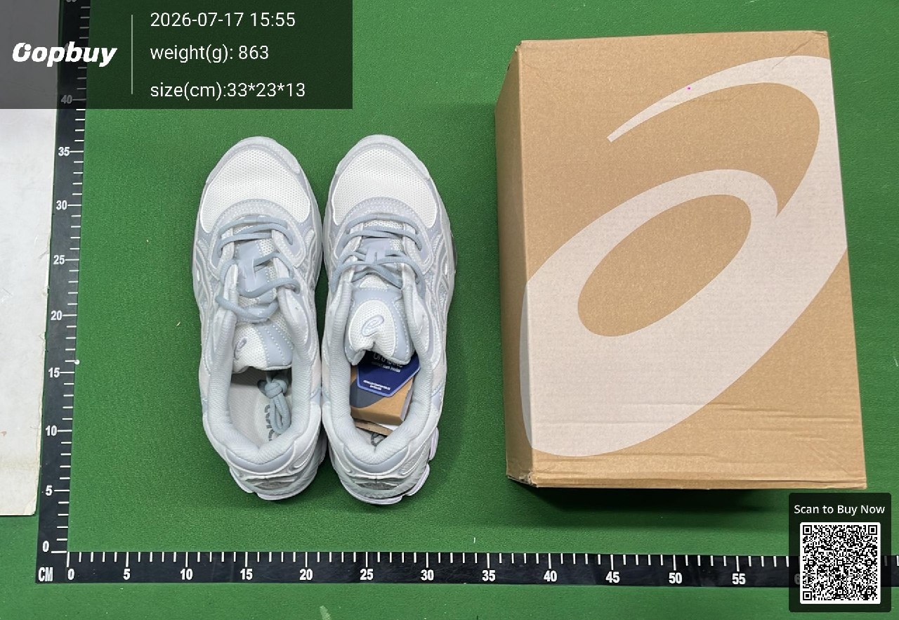 Two shoes and their box on the warehouse measuring mat